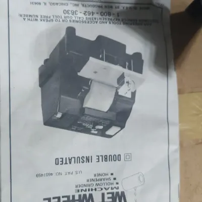 Sale Photo Thumbnail #369: Original owner's manual for a WEN Model 2908 wet wheel machine inside a cardboard box.