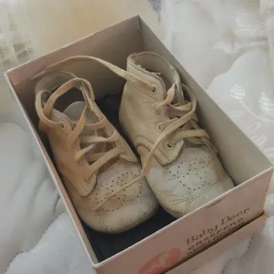 Sale Photo Thumbnail #201: Vintage Baby Deer Creepers white leather high-top baby shoes in original box, showing light age-related wear.