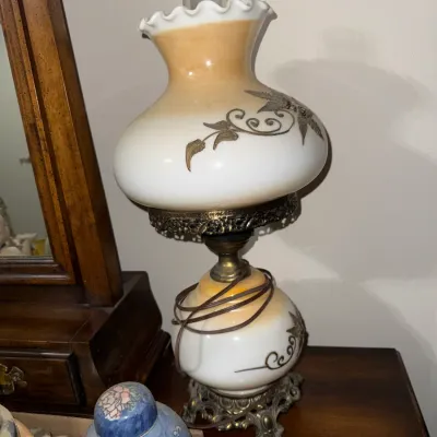 Sale Photo Thumbnail #12: Vintage Gone with the Wind style electric table lamp featuring a hand-painted floral scroll design on an ombre glass shade and base, mounted on an ornate brass pedestal.