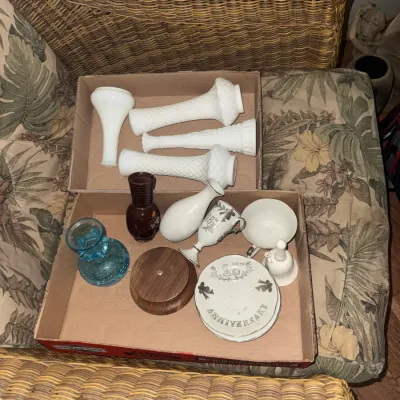 Sale Photo Thumbnail #2: Box lot of assorted glassware and ceramics, including Fenton milk glass diamond point vases, 25th anniversary porcelain tableware, and a blue glass candlestick holder.