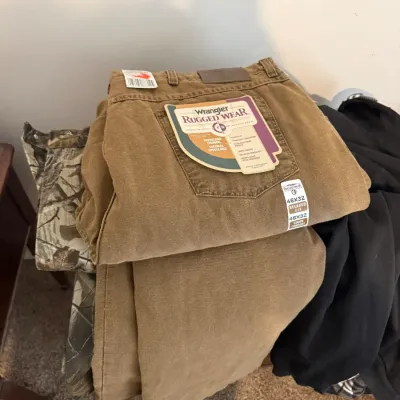 Sale Photo Thumbnail #27: New with tags Wrangler Rugged Wear thermal-lined brown canvas pants, size 46x32.