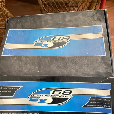 Sale Photo Thumbnail #55: Pair of boxed Crossfire SX 69 car audio coaxial speakers featuring original blue and silver graphic packaging.
