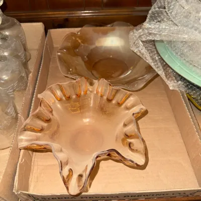 Sale Photo Thumbnail #6: Two vintage marigold carnival glass bowls featuring ruffled edges, displayed in a cardboard packing box.