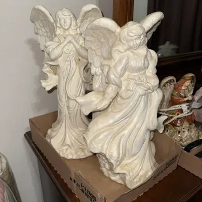 Sale Photo Thumbnail #10: Pair of vintage iridescent pearlized white ceramic angel figurines, featuring detailed robes and spread wings.