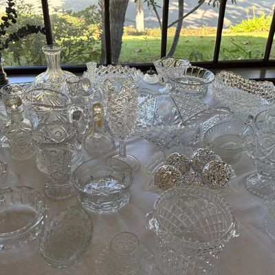 Sale Photo Thumbnail #33: Vintage pressed glass from the early 1900s. Among pieces shown include a spooner, pitcher, decanter, and bowls