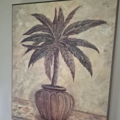 Sale Photo Thumbnail #63: Large square framed wall art depicting a potted palm tree in neutral earth tones with a textured background.
