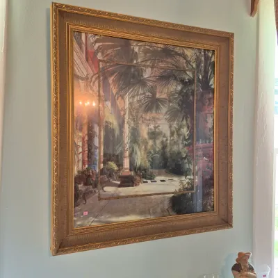 Sale Photo Thumbnail #36: Large framed wall art print depicting a conservatory courtyard garden scene, set in an ornate gilded gold frame.
