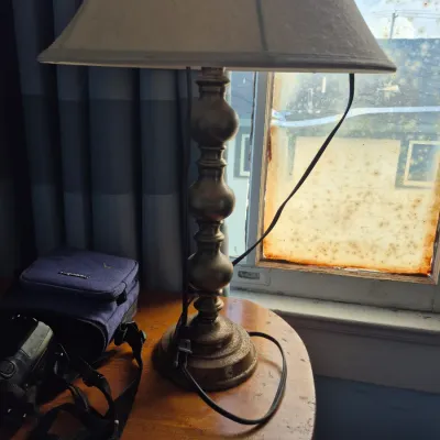 Sale Photo Thumbnail #72: Traditional brass-toned table lamp with a stacked orb body and a cream fabric lampshade.