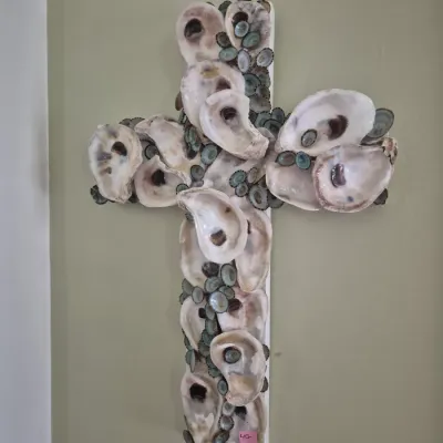Sale Photo Thumbnail #55: Handcrafted wall cross decorated with natural oyster and limpet sea shells mounted on a white wooden base.
