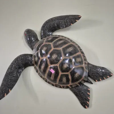 Sale Photo Thumbnail #65: Decorative sea turtle wall sculpture with carved scale textures and a glossy finish.