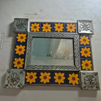 Sale Photo Thumbnail #114: Mexican folk art square mirror featuring hand-painted sunflower Talavera tiles and stamped tin accents.