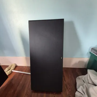 Sale Photo Thumbnail #92: Tall ZVOX audio speaker unit in a matte black finish, standing upright on hardwood floor.