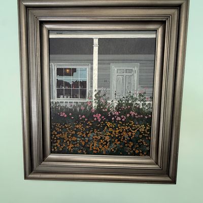 Framed original painting depicting a porch and flower garden, housed in a deep metallic bronze-toned wooden frame.