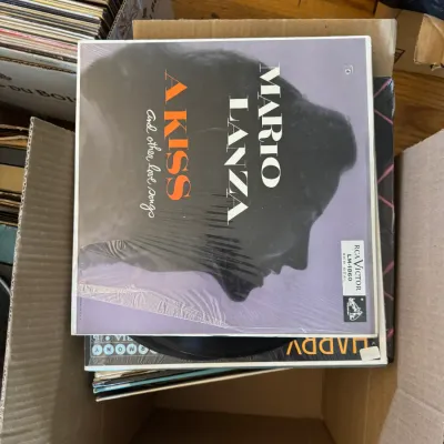 Sale Photo Thumbnail #160: Box of vintage vinyl LP records, featuring a sealed RCA Victor Red Seal album "A Kiss and Other Love Songs" by Mario Lanza.