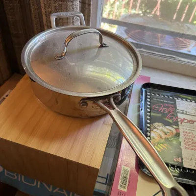 Sale Photo Thumbnail #150: Cuisinart stainless steel saute pan with lid, sitting alongside an Oscarware mini grill topper.