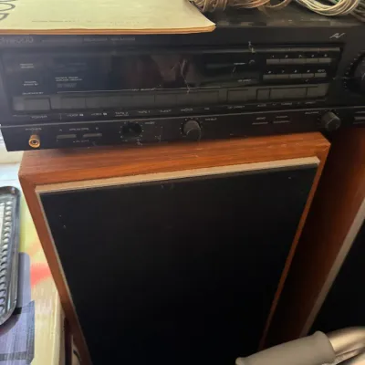 Sale Photo Thumbnail #21: Vintage Kenwood KR-A5020 AM/FM stereo receiver sitting atop a wooden speaker cabinet, complete with its original instruction manual and wiring.