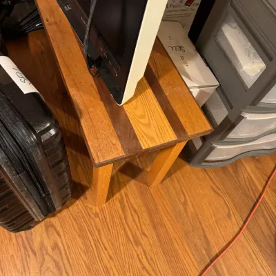 Sale Photo Thumbnail #90: Handcrafted wooden bench or side table with two-tone striping, paired with a small vintage Sony LCD TV.