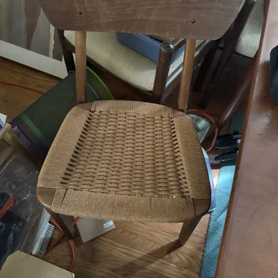 Sale Photo Thumbnail #17: Mid-century modern Danish style wooden side chair featuring a woven paper cord or jute seat and contoured backrest.