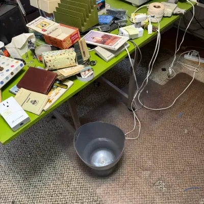 Sale Photo Thumbnail #51: A lime green desk cluttered with vintage office supplies, electronics, books, a Robt. Burns cigar box, and an avocado green letter organizer.