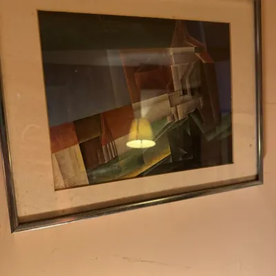 Sale Photo Thumbnail #165: Framed cubist abstract print featuring geometric architectural shapes, presented in a silver-tone metal frame with cream matting.