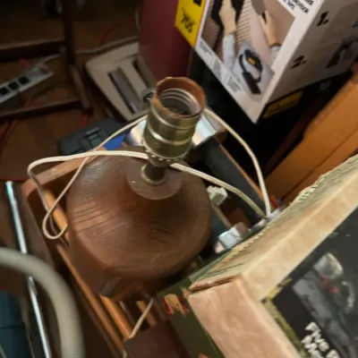 Sale Photo Thumbnail #148: Vintage carved wooden table lamp base featuring a rounded geometric design with visible wood grain.
