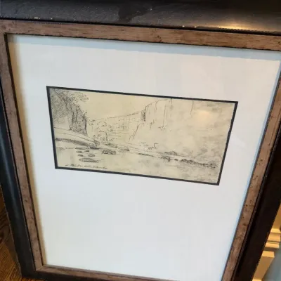 Sale Photo Thumbnail #40: Framed sketch depicting a canyon landscape, presented in a wide white mat and double wood frame.