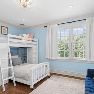 Sale Photo Thumbnail #10: White wooden loft bed set with an attached lower bed, desk, and ladder, shown alongside a blue velvet tufted bench.