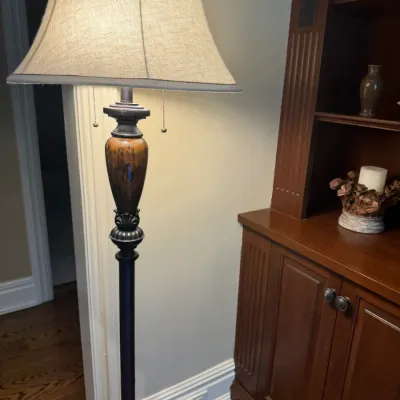 Sale Photo Thumbnail #47: Traditional floor lamp featuring a dark bronze finish, faux wood urn accent, dual pull chains, and a bell-shaped fabric shade.