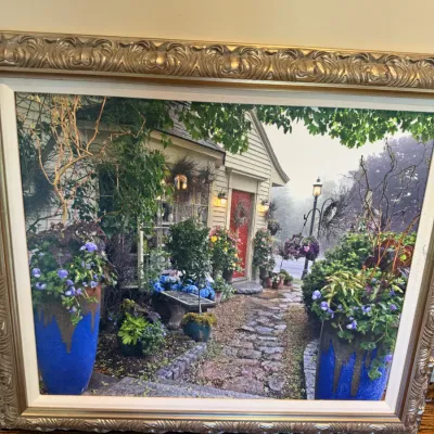 Sale Photo Thumbnail #37: Framed canvas print depicting a lush cottage garden path leading to a red door, set in an ornate carved gold-tone frame.