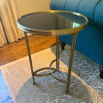 Sale Photo Thumbnail #32: Hollywood Regency style brass side table featuring faux bamboo legs and a dark inset glass top.