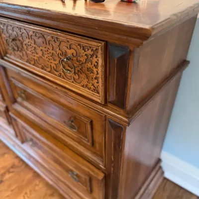 Sale Photo Thumbnail #91: Vintage Mediterranean Revival wooden dresser featuring carved scrollwork details on the top drawer front and decorative bail pull handles.