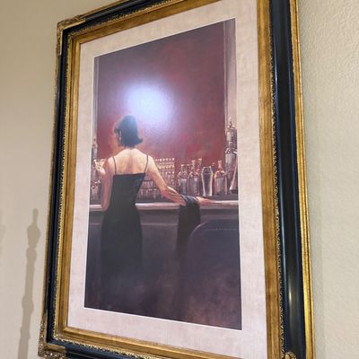 Sale Photo Thumbnail #55: Large framed art print depicting a woman in a black dress at a bar, housed in an ornate black and gold gilt wood frame.