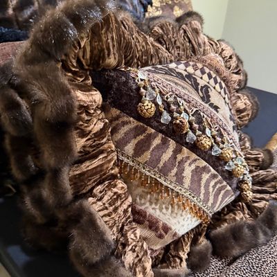 Sale Photo Thumbnail #61: Opulent decorative throw pillow featuring mixed textiles, animal print fabric, faux fur trim, ruffled velvet edging, and beaded tassel embellishments.