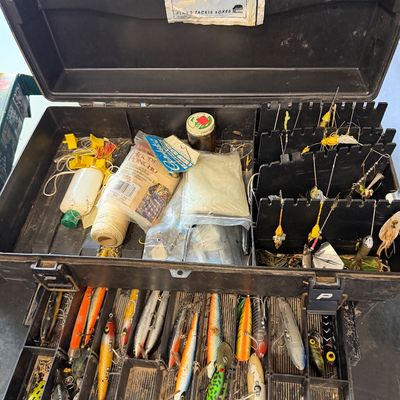 Sale Photo Thumbnail #104: Vintage Plano hard plastic tackle box loaded with fishing lures, line, jigs, and accessories.