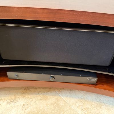 Sale Photo Thumbnail #79: Episode audio amplifier resting below a horizontal center channel speaker inside a wooden entertainment media console.