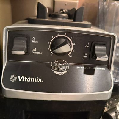 Sale Photo Thumbnail #44: Vitamix Professional Series blender base featuring The Culinary Institute of America branding, with variable speed control dial and toggle switches.