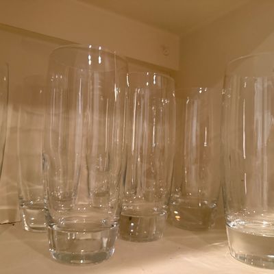 Sale Photo Thumbnail #49: Set of clear highball glasses featuring heavy, weighted bases and a slightly tapered silhouette.