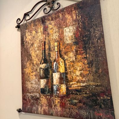 Sale Photo Thumbnail #39: Tuscan-style wine bottle canvas wall hanging featuring textured impasto painting suspended from a wrought-iron rod with fleur-de-lis detail.