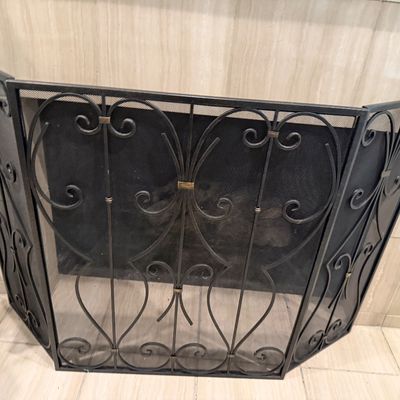 Sale Photo Thumbnail #85: Three-panel wrought iron fireplace screen featuring decorative scrollwork and fine mesh backing.