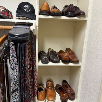 Sale Photo Thumbnail #28: Men's closet storage unit featuring assorted leather dress shoes, loafers, and boots alongside a selection of neckties and baseball caps.