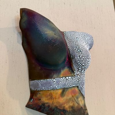 Sale Photo Thumbnail #38: Abstract enamel-on-copper female torso wall sculpture featuring crackle glaze accents and iridescent flame-patinated metal finishes.