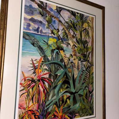 Sale Photo Thumbnail #105: Framed tropical landscape watercolor print depicting vibrant coastal flora and palm trees against an ocean backdrop.
