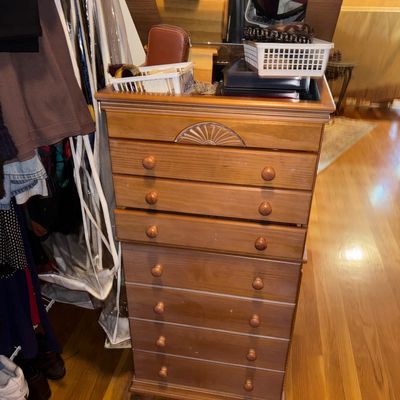 Sale Photo Thumbnail #75: Traditional oak standing jewelry armoire featuring a flip-top lid with an inset mirror and multiple pull-out drawers with wooden knobs.
