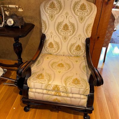 Sale Photo Thumbnail #79: Vintage high-back armchair featuring dark carved wooden frame with scroll arms, ball-and-claw feet, and yellow damask fabric upholstery.
