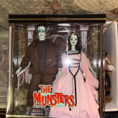Sale Photo Thumbnail #104: The Munsters Barbie Collector Edition giftset featuring Herman and Lily Munster, mint in original box.