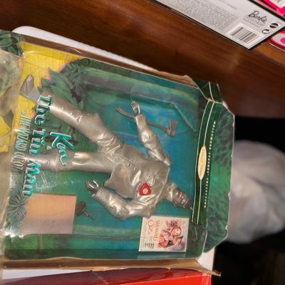 Sale Photo Thumbnail #122: Vintage 1996 Ken as The Tin Man collector doll from The Wizard of Oz Hollywood Legends Collection, in damaged original packaging.