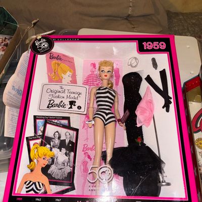 Sale Photo Thumbnail #101: Mattel 'My Favorite Barbie' 50th Anniversary reproduction doll of the 1959 Original Teenage Fashion Model, mint in original packaging with accessories.