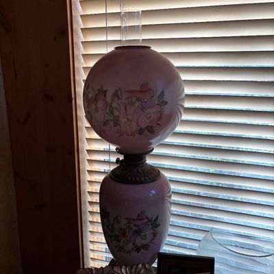 Sale Photo Thumbnail #65: Vintage Gone with the Wind style hurricane lamp featuring hand-painted pink floral motifs and a clear glass chimney.