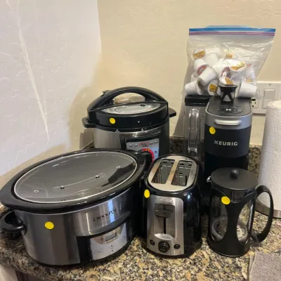 Sale Photo Thumbnail #25: Assorted small kitchen appliances including a Crock-Pot slow cooker, pressure cooker, 2-slice toaster, Keurig single-serve coffee maker, and a French press.