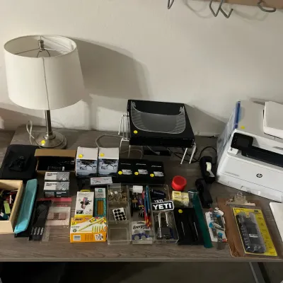 Sale Photo Thumbnail #5: Desk filled with various home office supplies, an HP printer, a table lamp, and hardware accessories.
